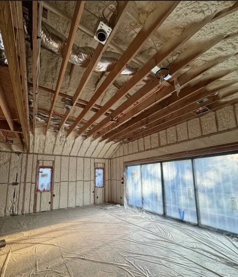 Interior walls and ceiling insulated with spray foam during new construction in Triana
